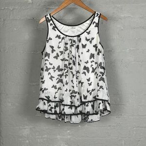 White and black butterfly sleeveless blouse with‎ ruffle hem #boho #fairy